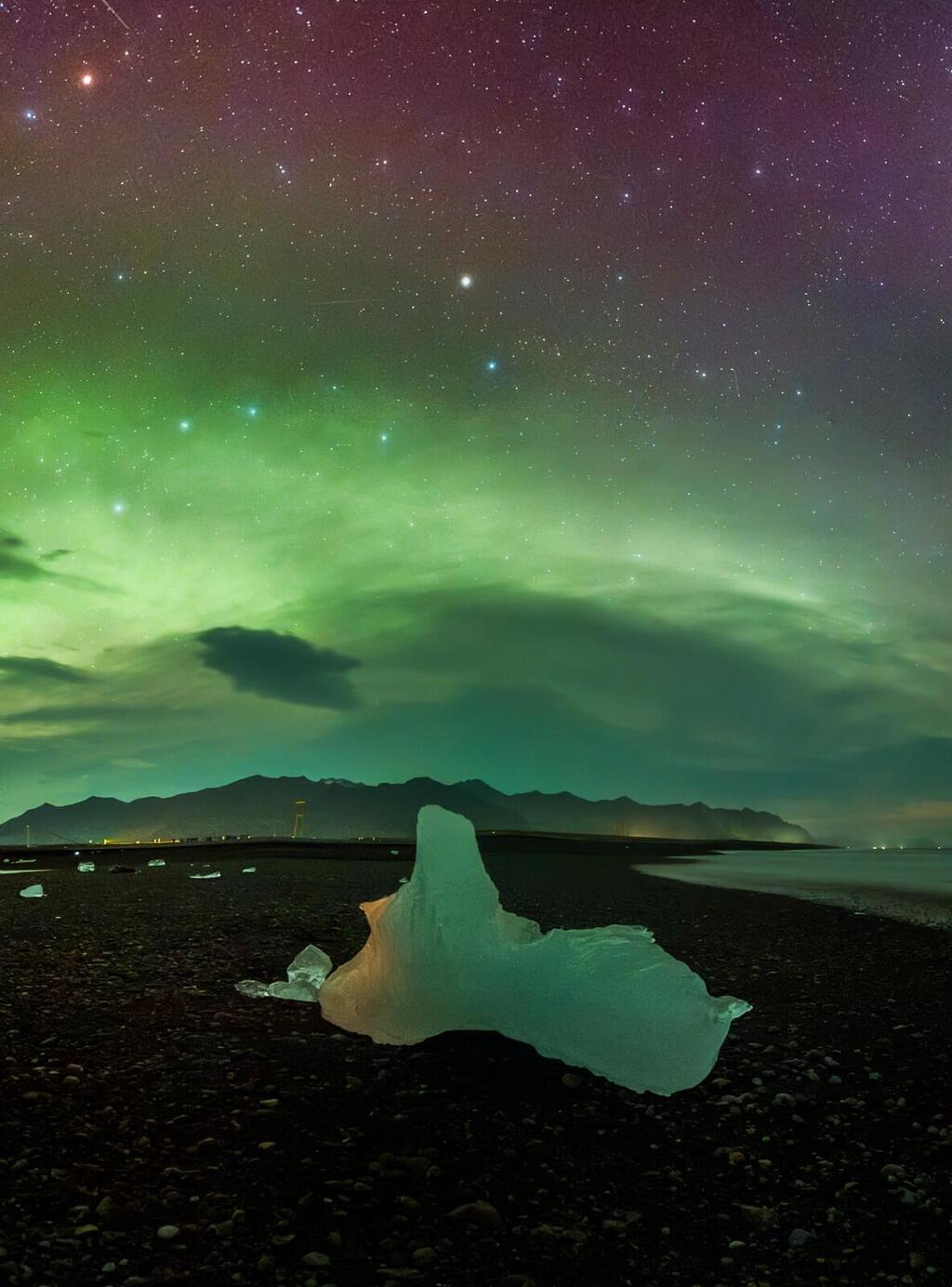 The Northern Lights and the Big Dipper on a huge glacier on the Diamond Coast