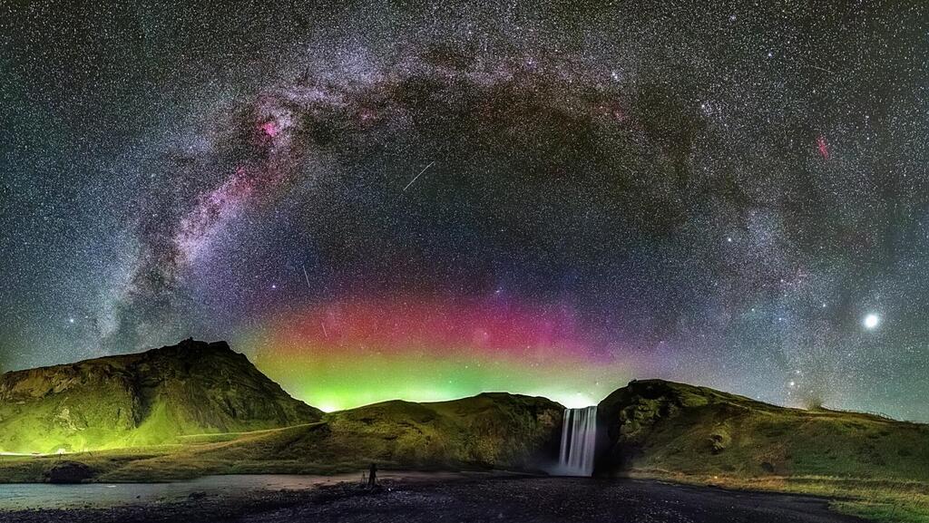 The Milky Way and the Northern Lights over Skoga Falls