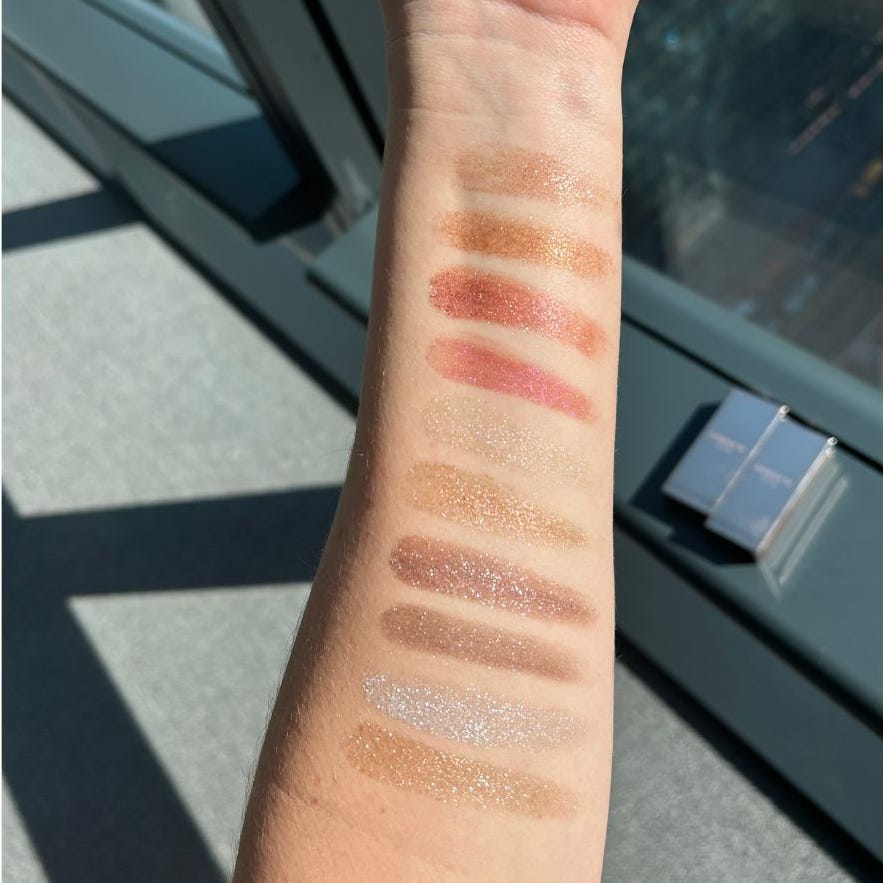 swatches of different cosmetic shades on forearm